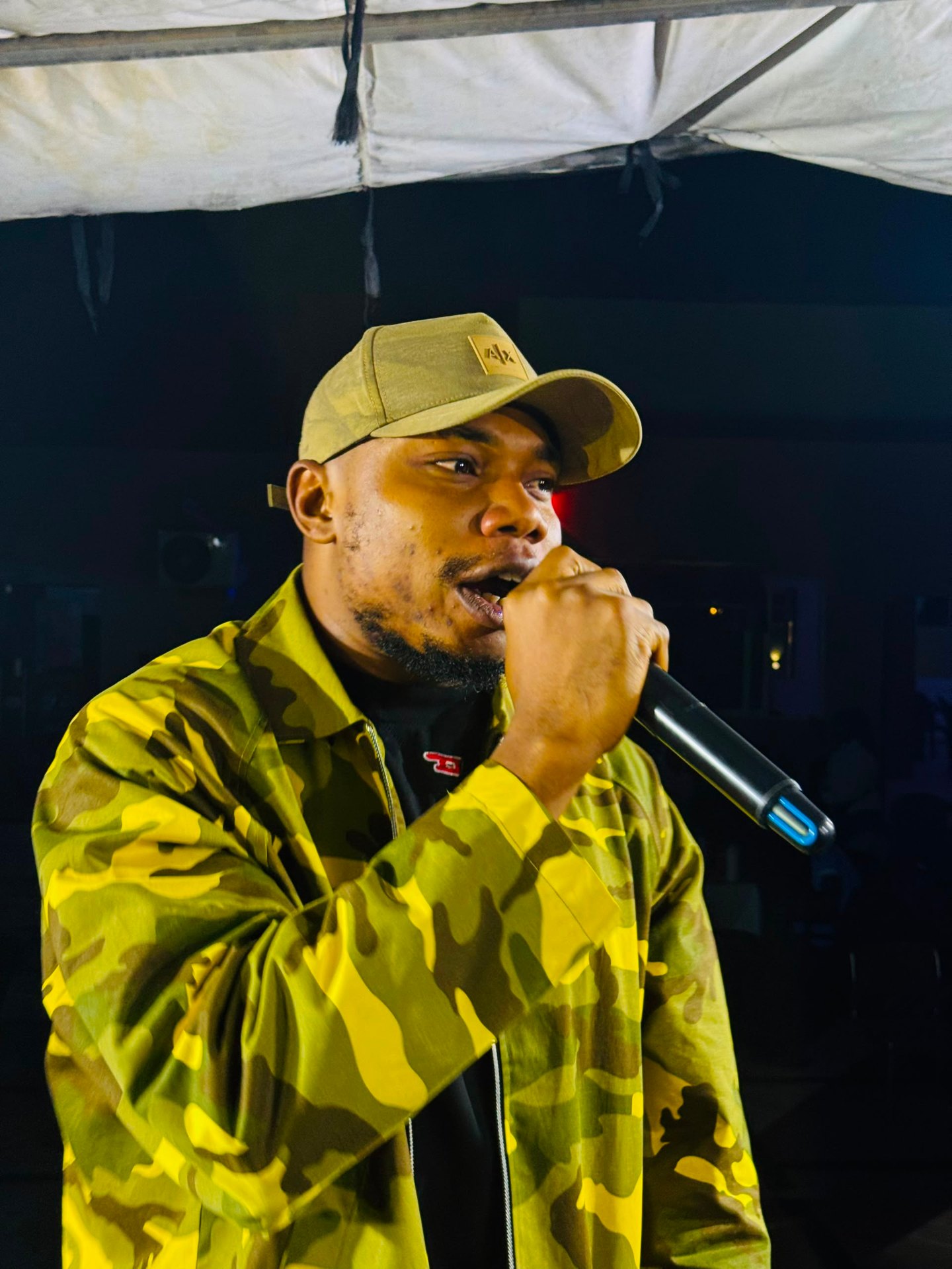 H3RITAGE performing live on stage — official concert close-up photograph