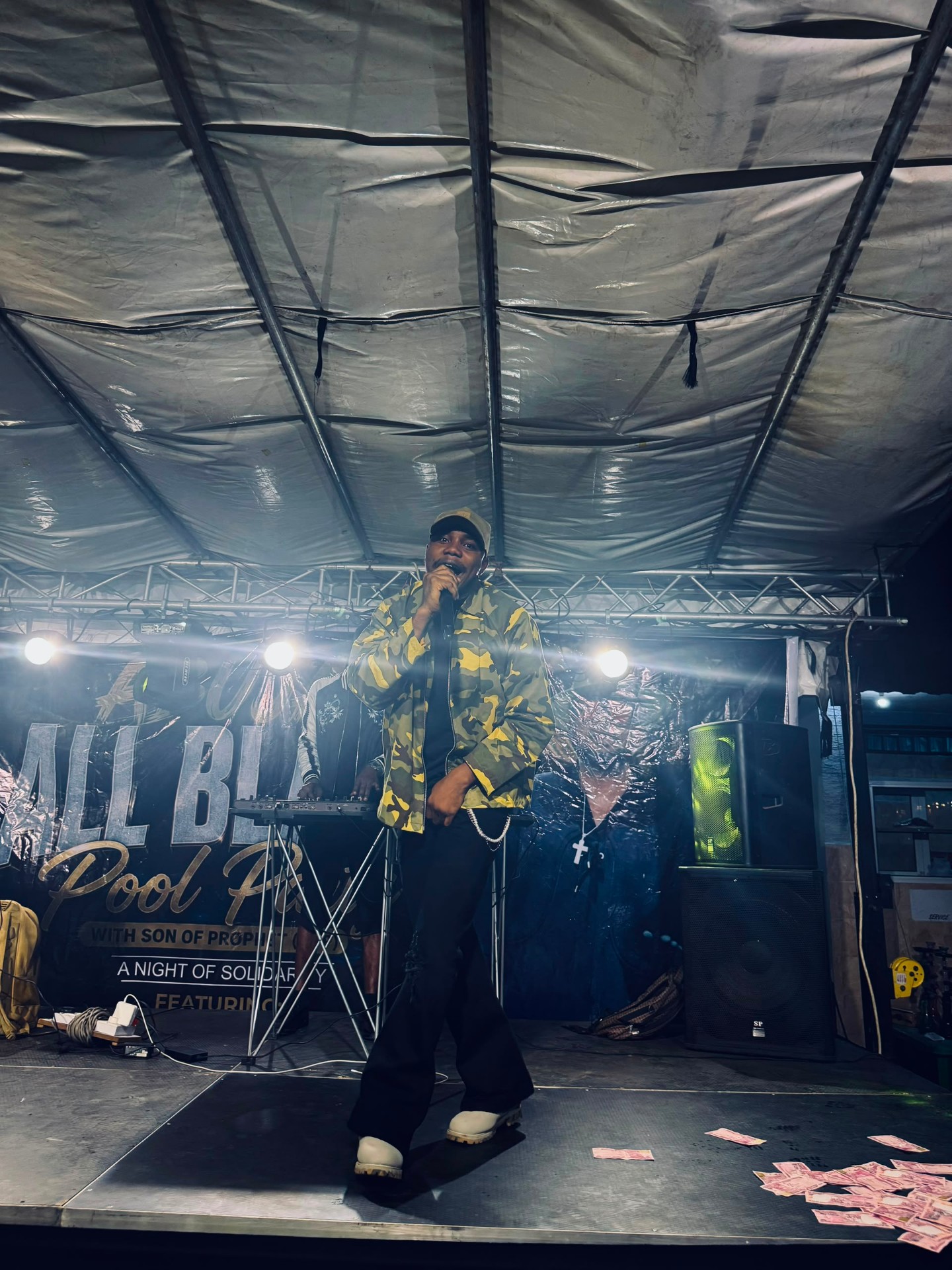 H3RITAGE on stage under spotlights — official live performance photograph