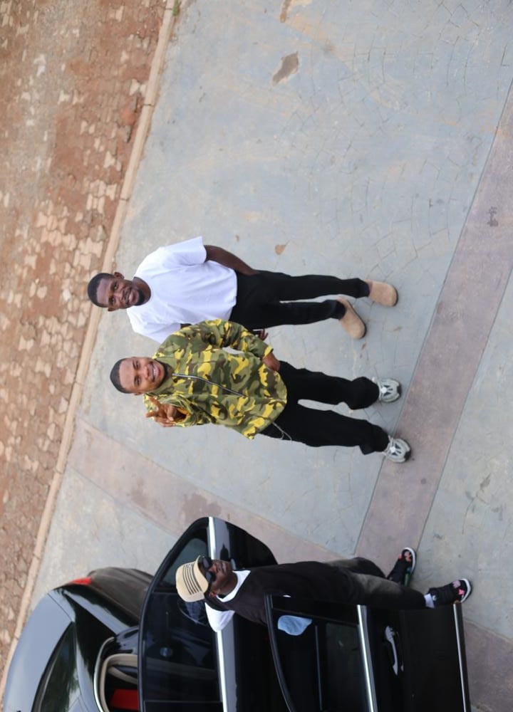H3RITAGE in a camo jacket photographed beside a car
