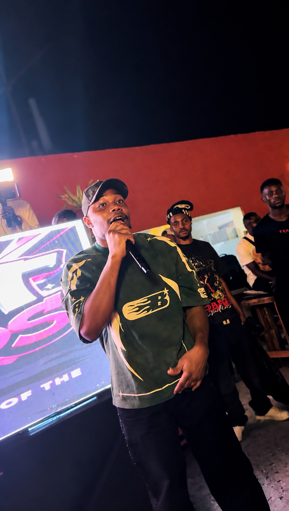 H3RITAGE in a green shirt — editorial portrait of the Nigerian artist